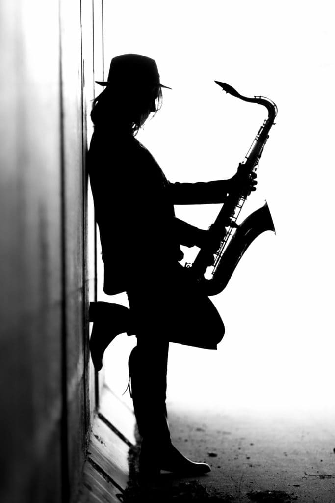 holding the saxophone