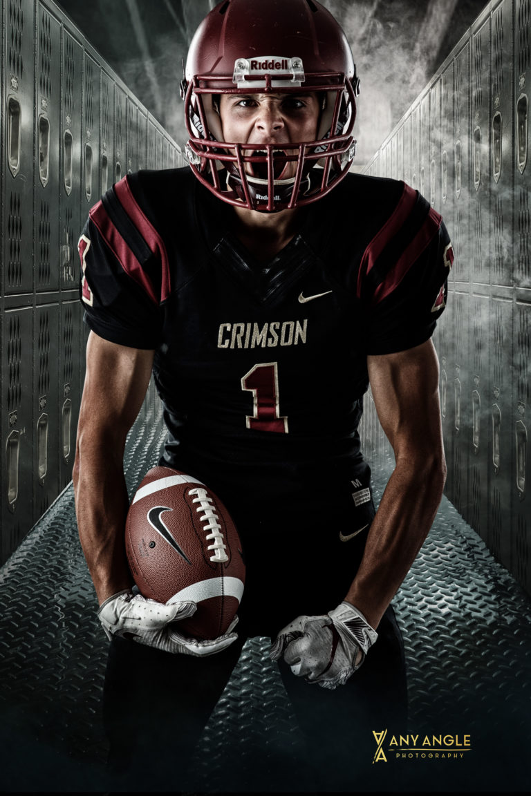Minneapolis sports senior pictures of Maple Grove Senior High football player in studio. Athlete photographed on neutral background and then composited into locker room. Captured by Minnesota sports senior photographer Any Angle Photography.