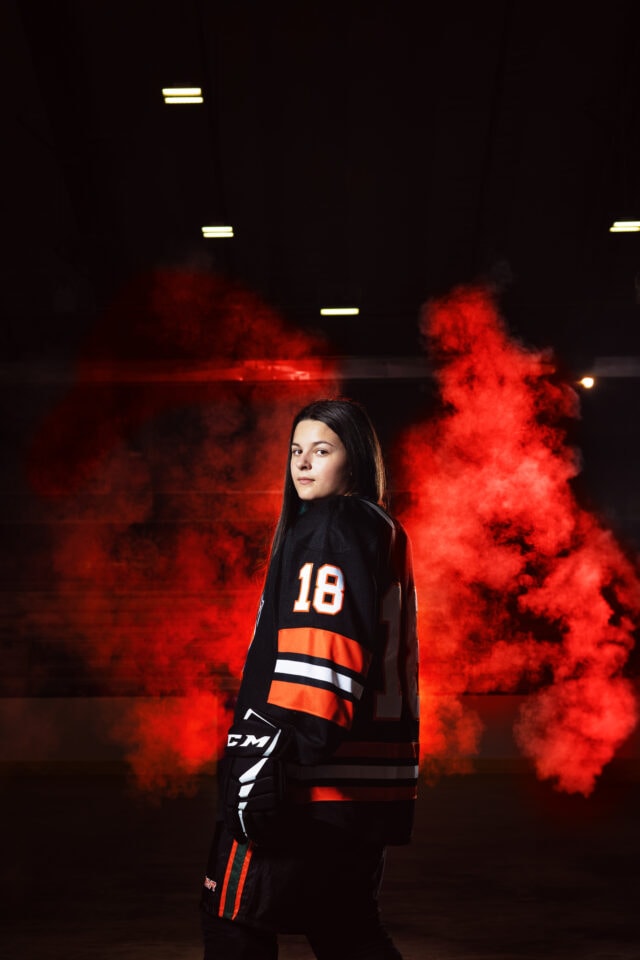 Senior pictures with hockey player at Osseo High School in Minneapolis. Captured by Any Angle Photography.