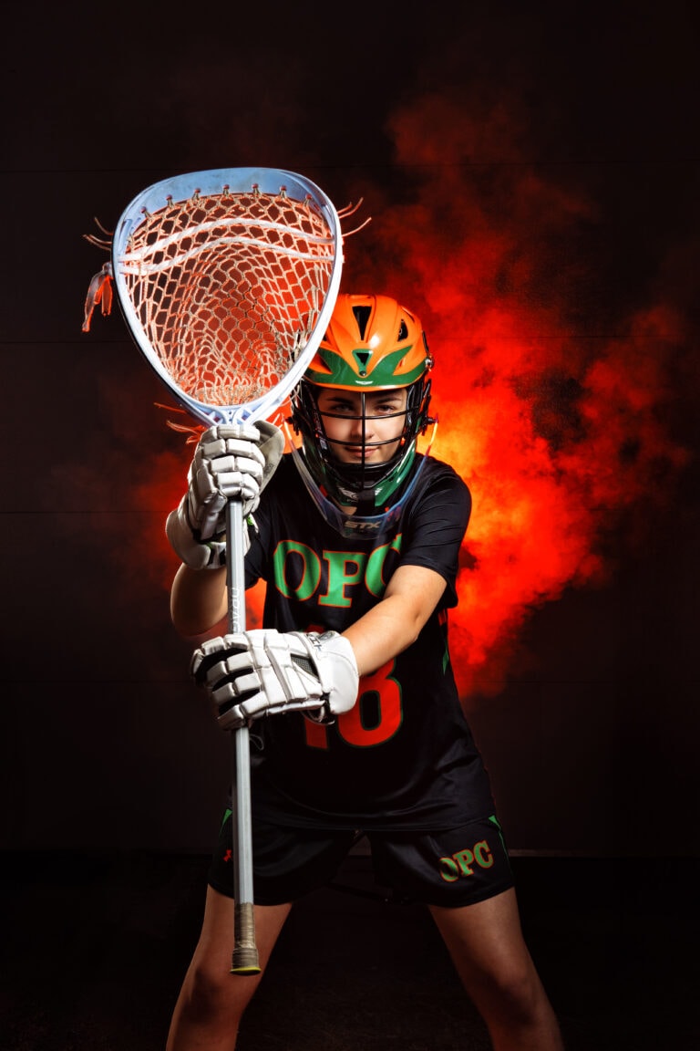 Senior pictures with lacrosse player at Osseo High School in Minneapolis. Captured by Any Angle Photography.