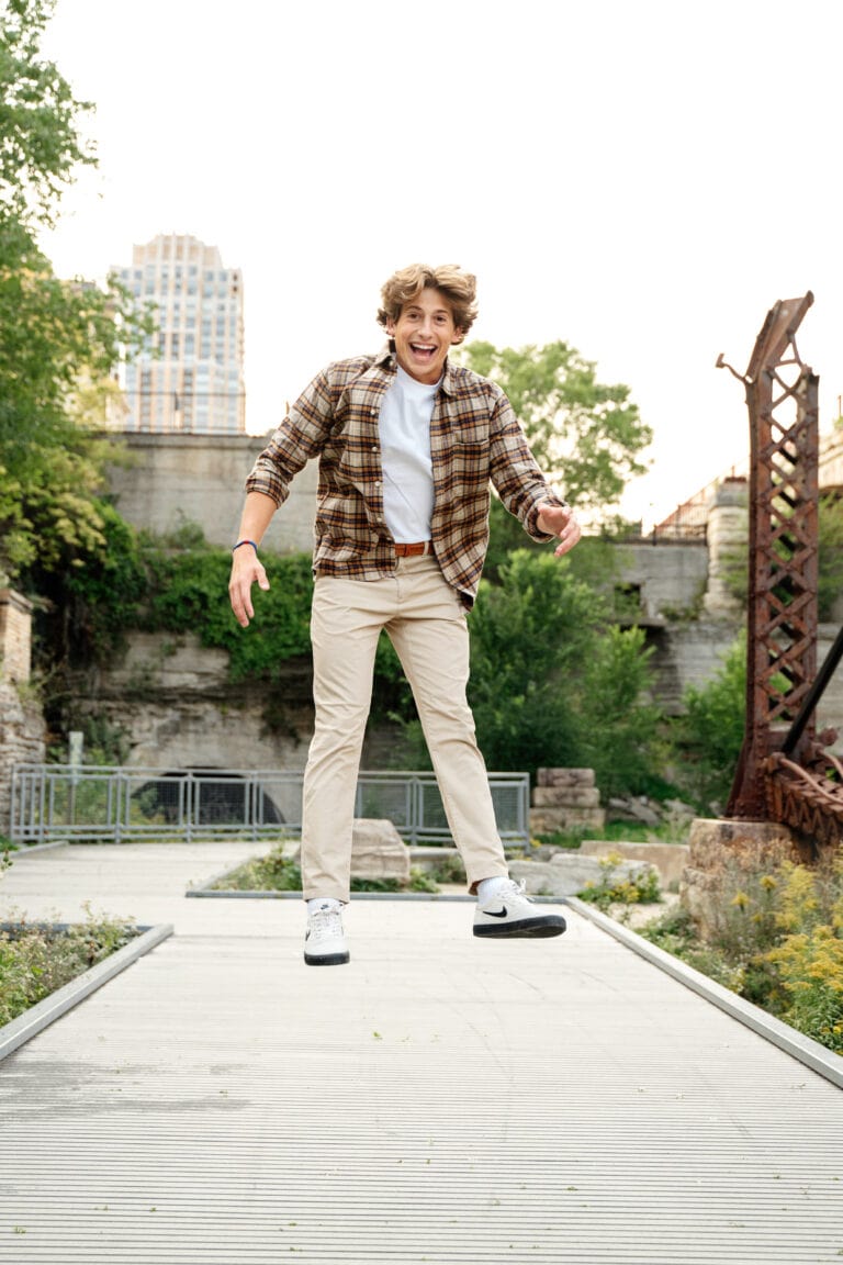 Guy jumping at the Mill City Ruins in Minneapolis, Minnesota. Captured by Minneapolis Senior Photographer, Any Angle Photography.