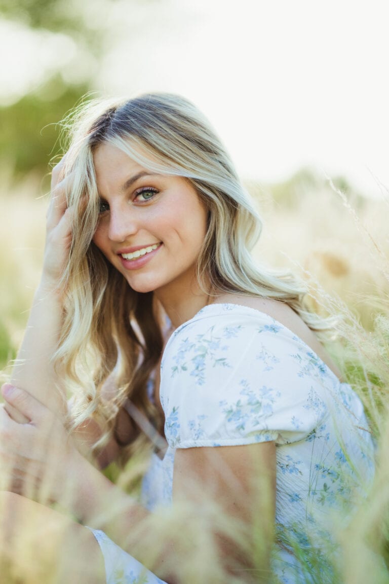 Senior pictures with girl in wheat field at Thanksgiving Point, Utah. Captured by Utah senior photographer Any Angle Photography.